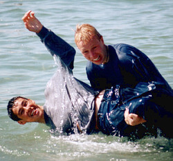 wet guys in jeans and sweatshirt